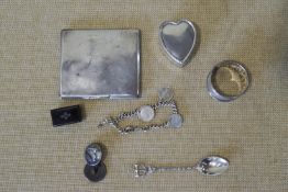 A silver cigarette case and other items