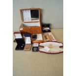 A quantity of costume jewellery in a wooden jewellery box