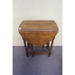 Two oak gate leg tables with barley twist legs,