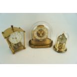 Two domed clocks and another