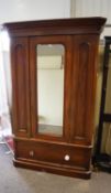 A Victorian mahogany wardrobe with mirror door,