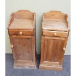 A pair of pine bedside cupboards,