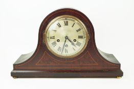 An Edwardian helmet form mantel clock,