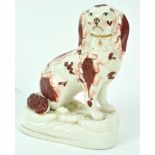 A Victorian Staffordshire porcelain figure of a spaniel,