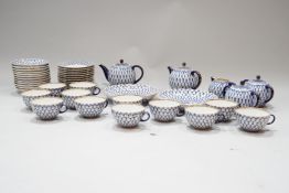 A Russian porcelain tea service,m comprising two tea pots and covers, two sucrieres and covers,