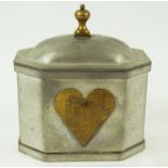 A Dutch Arts and Crafts pewter tea caddy, with brass heart detail, 15.