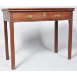 A George III mahogany card table, with one frieze drawer, on square tapering legs,