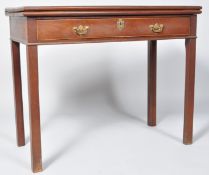 A George III mahogany card table, with one frieze drawer, on square tapering legs,