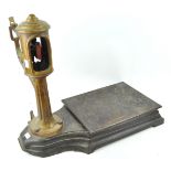 A set of cast iron and brass weighing scales, manufactured by A J Avery,
