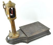 A set of cast iron and brass weighing scales, manufactured by A J Avery,