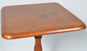 A mid 19th century mahogany tripod table,