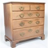 A George III mahogany chest of two short and three long drawers, with a brushing slide,