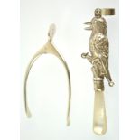 A pair of hinged silver sugar nips in the form of a wishbone, Birmingham 1940, 9cm high, 14 grams,