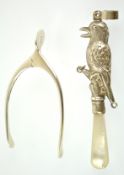 A pair of hinged silver sugar nips in the form of a wishbone, Birmingham 1940, 9cm high, 14 grams,