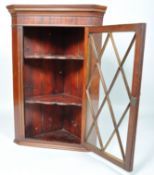 A 19th century mahogany hanging corner cabinet with lattice astragal glazed door,