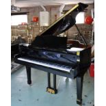 A 20th century baby grand piano with black lacquered finish, iron framed and over-strung,