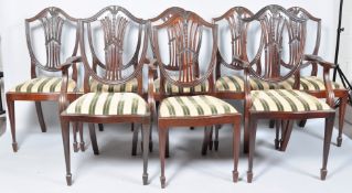 A set of six plus two Edwardian mahogany dining chairs with shield shaped backs (8) 103cm high x