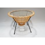 A mid-century wicker, metal and glass coffee table, of drum shaped form, with glass top,