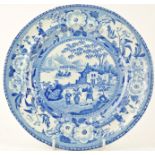 An early 19th century blue and white plate printed with a Chinese scene,