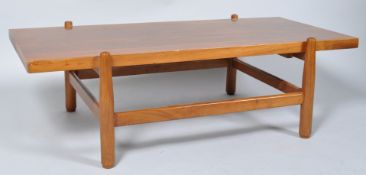 A 1960's retro vintage teak wood coffee table, having a floating top,