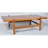 A 1960's retro vintage teak wood coffee table, having a floating top,