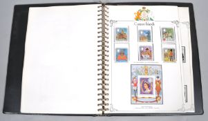 A 25th Anniversary of Coronation UMM stamp Lyndhurst album, with global stamps,