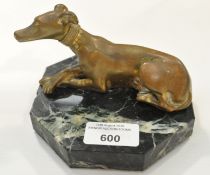 A bronze model of a whippet, mounted on an octagonal marble base,