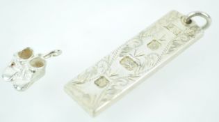 A sterling silver large ingot pendant with engraved finish and feature hallmark (Sterling silver,