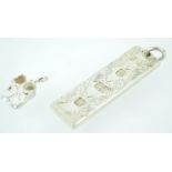 A sterling silver large ingot pendant with engraved finish and feature hallmark (Sterling silver,