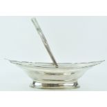 A silver cake basket, of oval form, with ribbed shaped edge terminating in points,