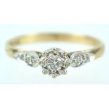 A yellow and white metal single stone ring set with round brilliant cut diamond of approximately 0.