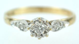 A yellow and white metal single stone ring set with round brilliant cut diamond of approximately 0.