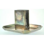 A silver plated White Star Line match box holder of rectangular form, on a shaped octangular base,