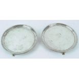A pair of silver salvers, of plain rounded form with reeded edges and on plain feet, Edinburgh 1798,