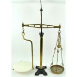 A set of cast iron, brass and pottery scales,