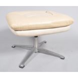 A 1960's rectangular retro footstool on aluminum swivel base,