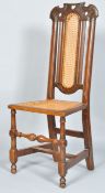 A 19th century oak chair with 18th century crest, caned back and seat,