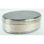 A white metal oval snuff box with moss agate top and base,