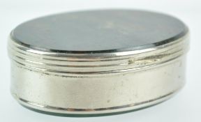 A white metal oval snuff box with moss agate top and base,