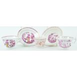 A pair of pink lustre porcelain tea cups and saucers, circa 1840,