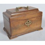 A George III mahogany tea caddy, of rectangular form, with brass swing handle and scroll escutcheon,
