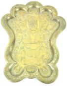 An Indian brass tray, of scroll outline, decorated with Hanuman among scrolls,