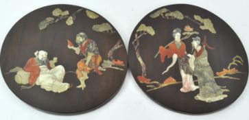 A pair of 20th century Chinese round hanging panels,