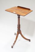 An early 19th century mahogany reading table,