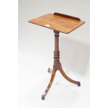 An early 19th century mahogany reading table,