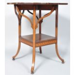An Edwardian mahogany shaped occasional table with satinwood cross banding,