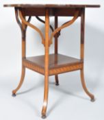 An Edwardian mahogany shaped occasional table with satinwood cross banding,