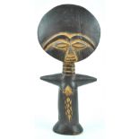 An Ashanti Akn'aba ritual fertility doll, with carved features in the traditional manner,