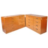 A pair of 1970's teak G-Plan chests of eight drawers, with inset handles on plinth bases,
