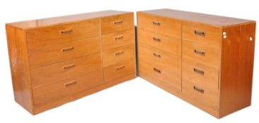 A pair of 1970's teak G-Plan chests of eight drawers, with inset handles on plinth bases,